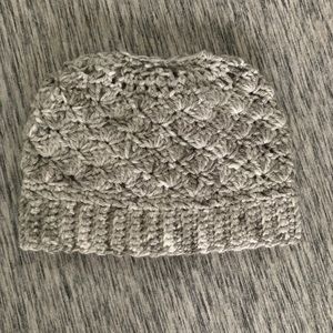 Marled grey messy bun beanie girl .